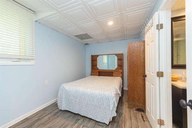 bedroom featuring wood-type flooring