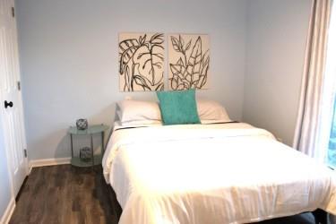 bedroom featuring dark hardwood / wood-style flooring