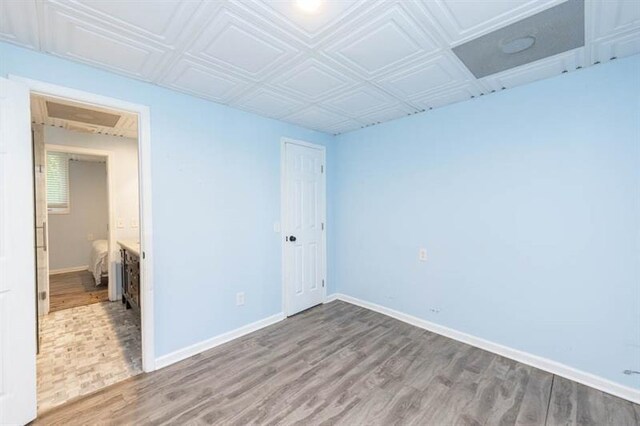 unfurnished room featuring hardwood / wood-style floors