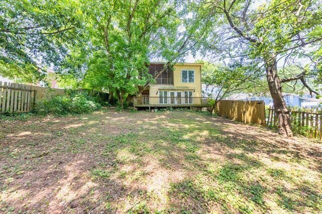 view of yard with a wooden deck