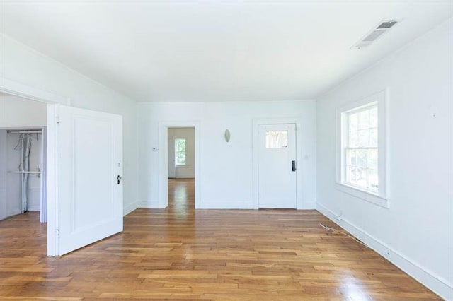 spare room with light hardwood / wood-style flooring