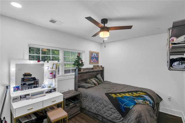 bedroom with dark wood-type flooring and ceiling fan