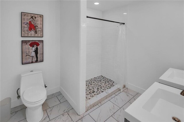 bathroom featuring sink, toilet, and a shower with shower curtain