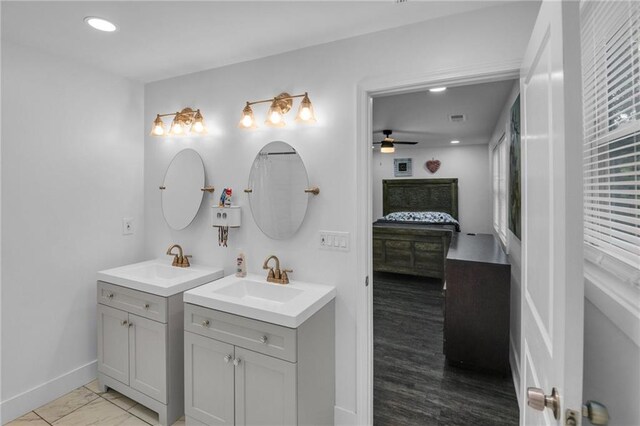 bathroom featuring hardwood / wood-style flooring, vanity, and ceiling fan