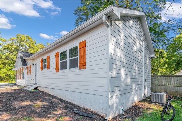 view of side of home with cooling unit