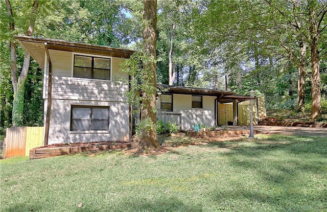 view of front of property with fence and a front lawn