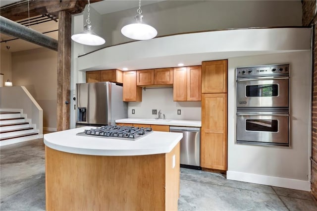 kitchen with light countertops, stainless steel appliances, baseboards, and concrete flooring