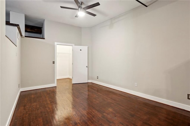 empty room with baseboards, a ceiling fan, and hardwood / wood-style flooring