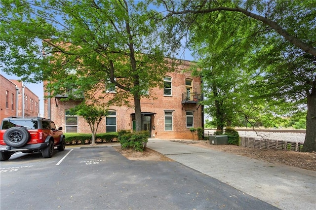view of property featuring uncovered parking