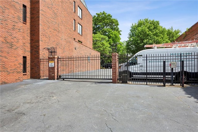 view of gate with fence