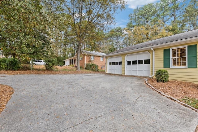 view of property exterior with a garage