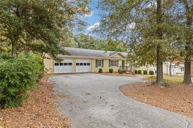 single story home featuring a garage