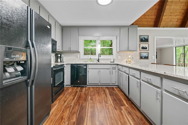 182 White Eagle Dr, Waleska, GA 30183 - kitchen with black appliances, gray cabinets, dark wood-style floors, beamed ceiling, and a sink