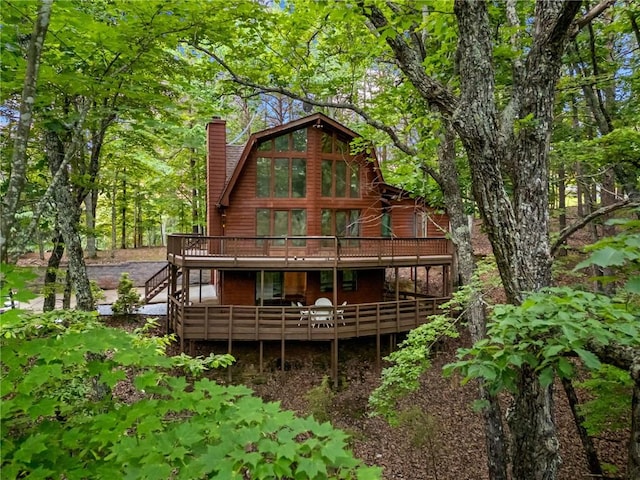 182 White Eagle Dr, Waleska, GA 30183 - rear view of house with a deck, a chimney, and stairway