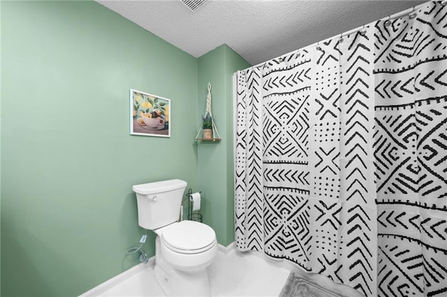 182 White Eagle Dr, Waleska, GA 30183 - bathroom featuring a textured ceiling, toilet, and baseboards