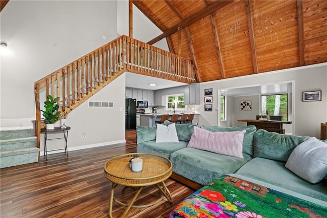 182 White Eagle Dr, Waleska, GA 30183 - living area with high vaulted ceiling, dark wood-style flooring, stairway, wood ceiling with exposed beams, and baseboards