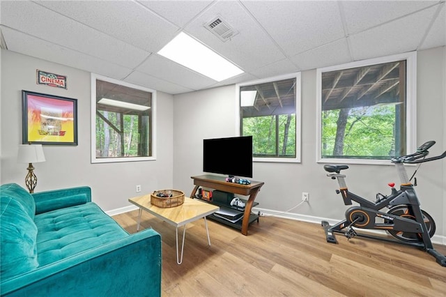182 White Eagle Dr, Waleska, GA 30183 - living room featuring a paneled ceiling, light wood-type flooring, and baseboards