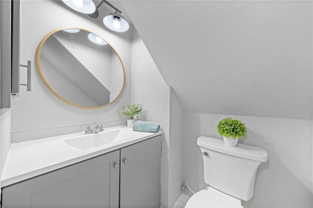 182 White Eagle Dr, Waleska, GA 30183 - bathroom featuring toilet, lofted ceiling, and vanity