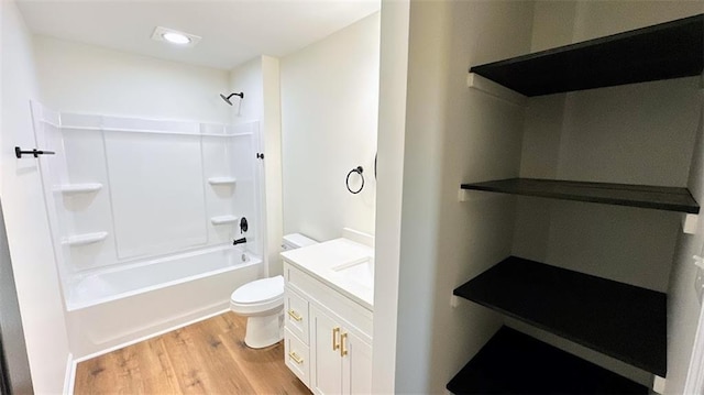 bathroom featuring vanity, wood finished floors, recessed lighting, shower / bath combination, and toilet