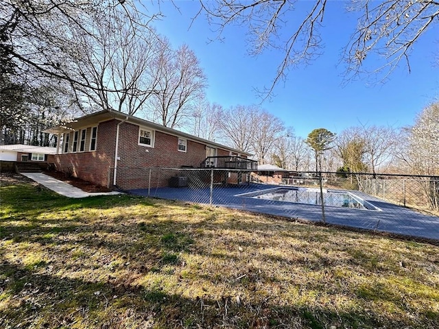 exterior space featuring a fenced in pool and fence