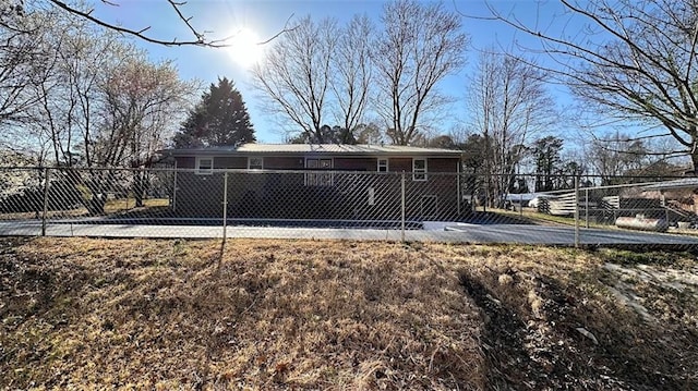 back of property featuring a fenced front yard