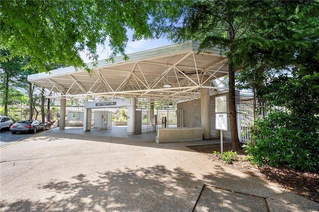 view of car parking featuring mail area