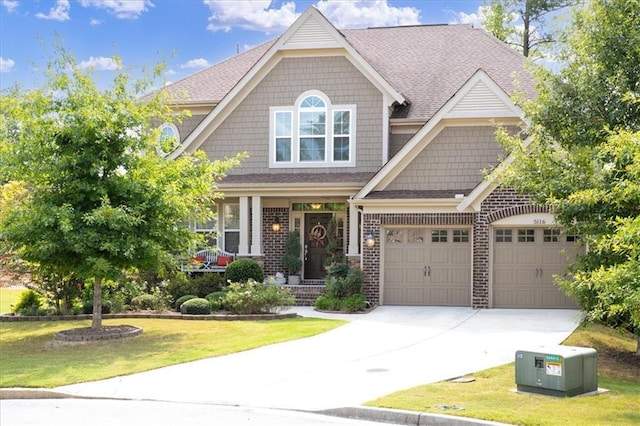 craftsman inspired home with a front lawn and a garage