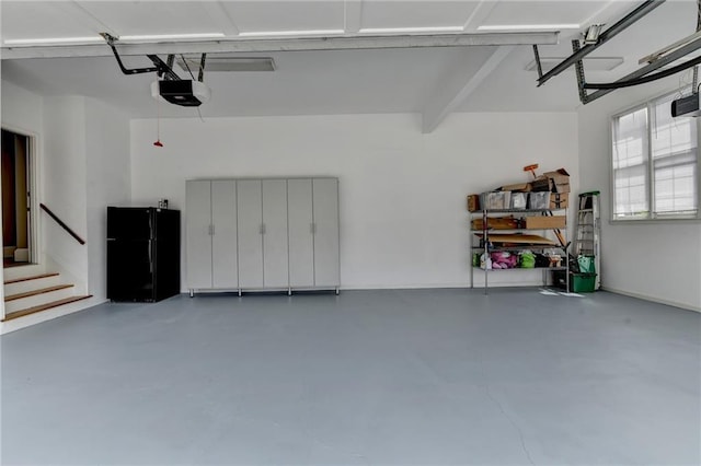 12130 Helleri Holw, Alpharetta, GA 30005 - garage with freestanding refrigerator and a garage door opener