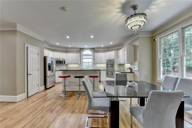 12130 Helleri Holw, Alpharetta, GA 30005 - dining room with light wood-style flooring, recessed lighting, crown molding, baseboards, and a chandelier