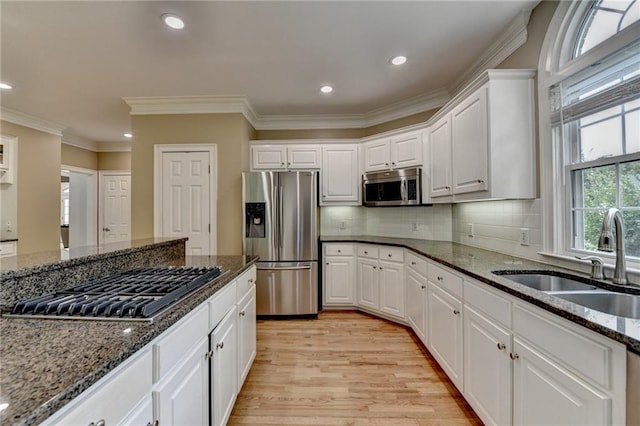 12130 Helleri Holw, Alpharetta, GA 30005 - kitchen featuring stainless steel appliances, a sink, white cabinetry, light wood finished floors, and recessed lighting
