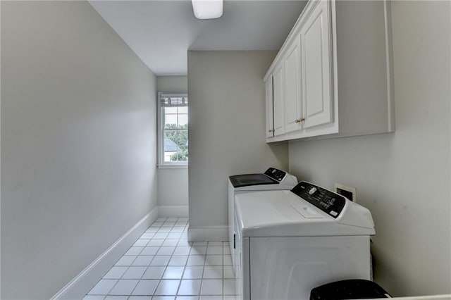 12130 Helleri Holw, Alpharetta, GA 30005 - laundry room with cabinet space, washing machine and clothes dryer, baseboards, and light tile patterned floors