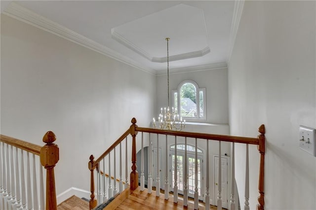 12130 Helleri Holw, Alpharetta, GA 30005 - stairway with a chandelier, wood finished floors, crown molding, and a tray ceiling