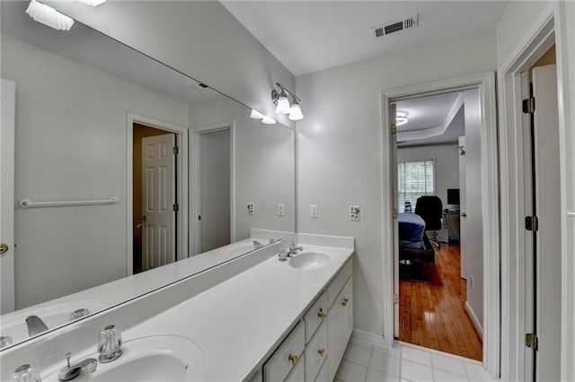 12130 Helleri Holw, Alpharetta, GA 30005 - bathroom featuring double vanity, connected bathroom, baseboards, and tile patterned floors