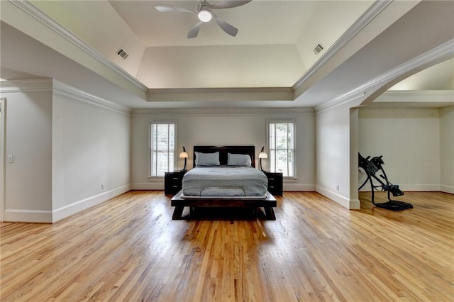 12130 Helleri Holw, Alpharetta, GA 30005 - bedroom featuring arched walkways, light wood-type flooring, baseboards, crown molding, and a raised ceiling