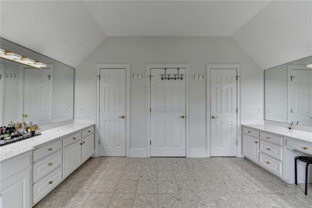 12130 Helleri Holw, Alpharetta, GA 30005 - bathroom with vaulted ceiling, vanity, and tile patterned flooring