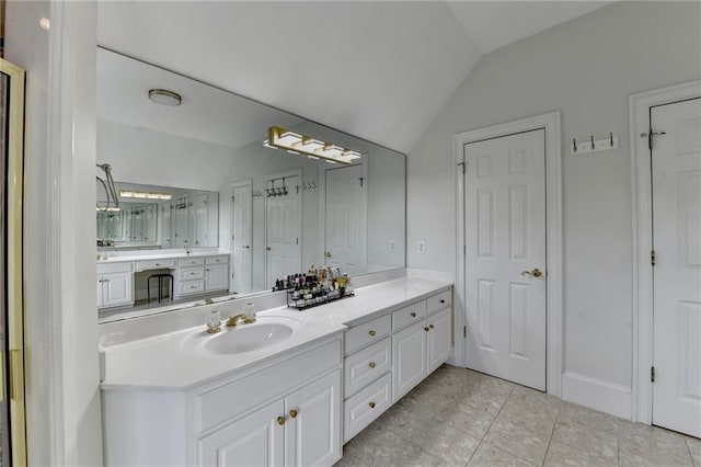 12130 Helleri Holw, Alpharetta, GA 30005 - bathroom with vaulted ceiling, vanity, and tile patterned flooring