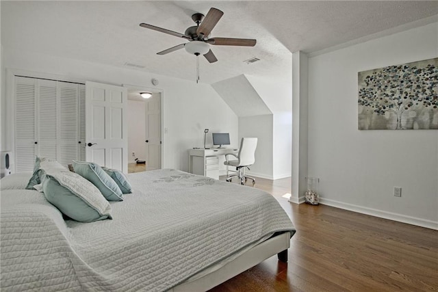 bedroom with a textured ceiling, a closet, ceiling fan, and dark hardwood / wood-style flooring