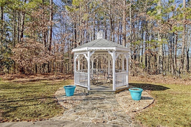 view of outbuilding with a lawn and a gazebo