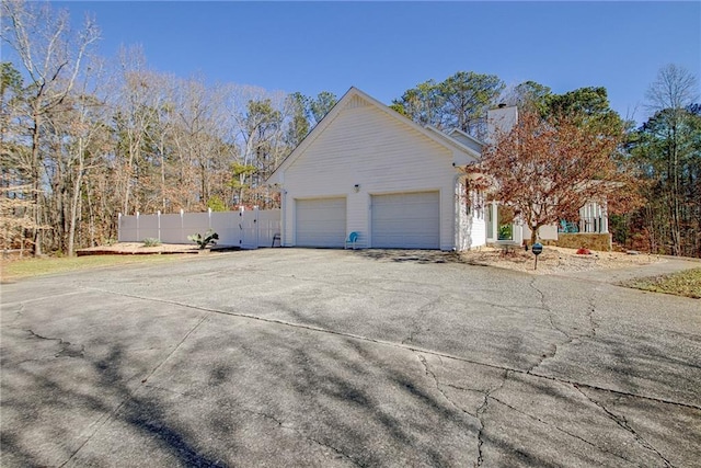 view of side of property with a garage