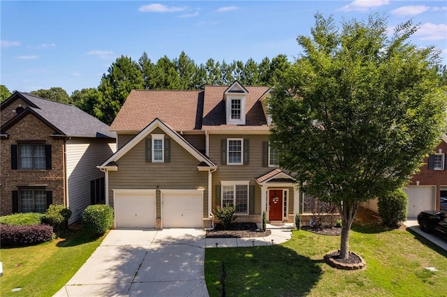 view of front of house with driveway and a front lawn