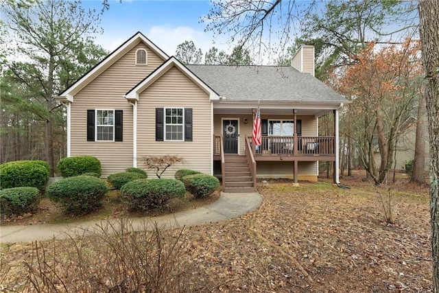 single story home featuring roof with shingles, a porch, and a chimney