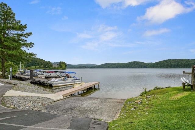 dock area with a water and mountain view