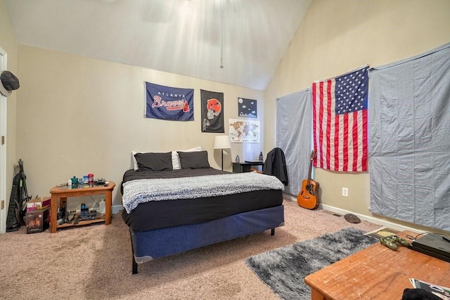 carpeted bedroom featuring high vaulted ceiling