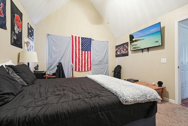 bedroom featuring carpet floors and vaulted ceiling