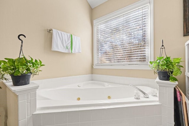 bathroom with tiled tub