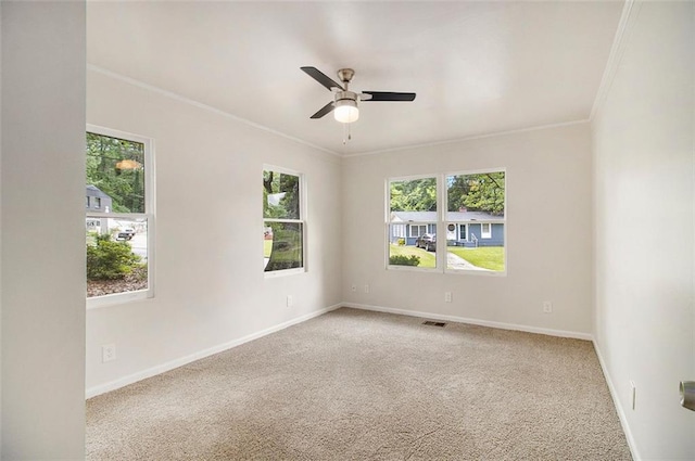 3294 Renault Rd SE, Atlanta, GA 30354 - carpeted empty room with plenty of natural light, ornamental molding, ceiling fan, and baseboards