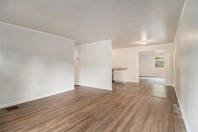 3294 Renault Rd SE, Atlanta, GA 30354 - empty room featuring dark wood finished floors, crown molding, and baseboards