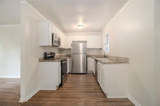 3294 Renault Rd SE, Atlanta, GA 30354 - kitchen with stainless steel appliances, a sink, light stone countertops, dark wood-style flooring, and white cabinets