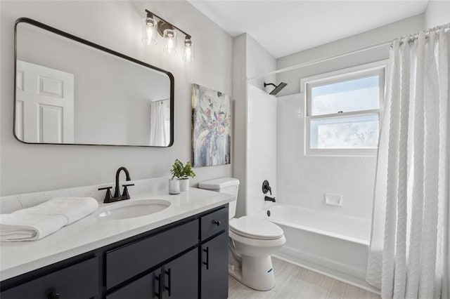 bathroom with toilet, shower / bathtub combination with curtain, and vanity