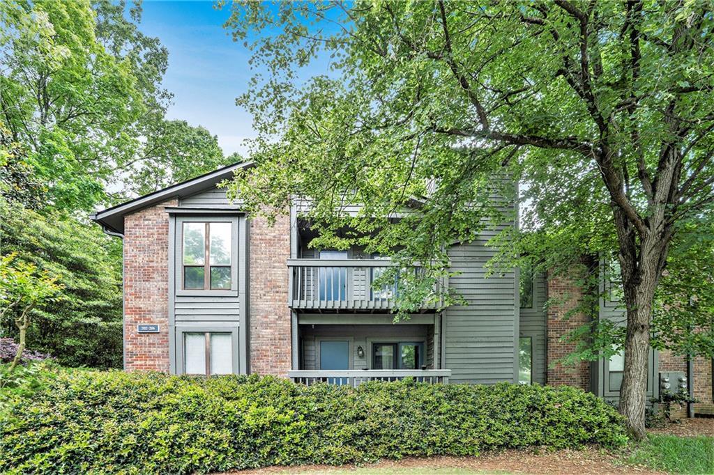 205 Tuxworth Cir Unit 205, Decatur, GA 30033 - exterior space with brick siding and a balcony